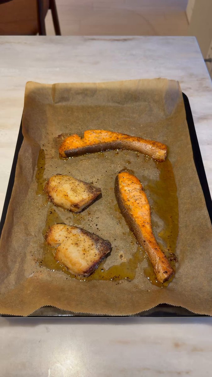 Grok Bot controls an oven to cook salmon and yellowtail